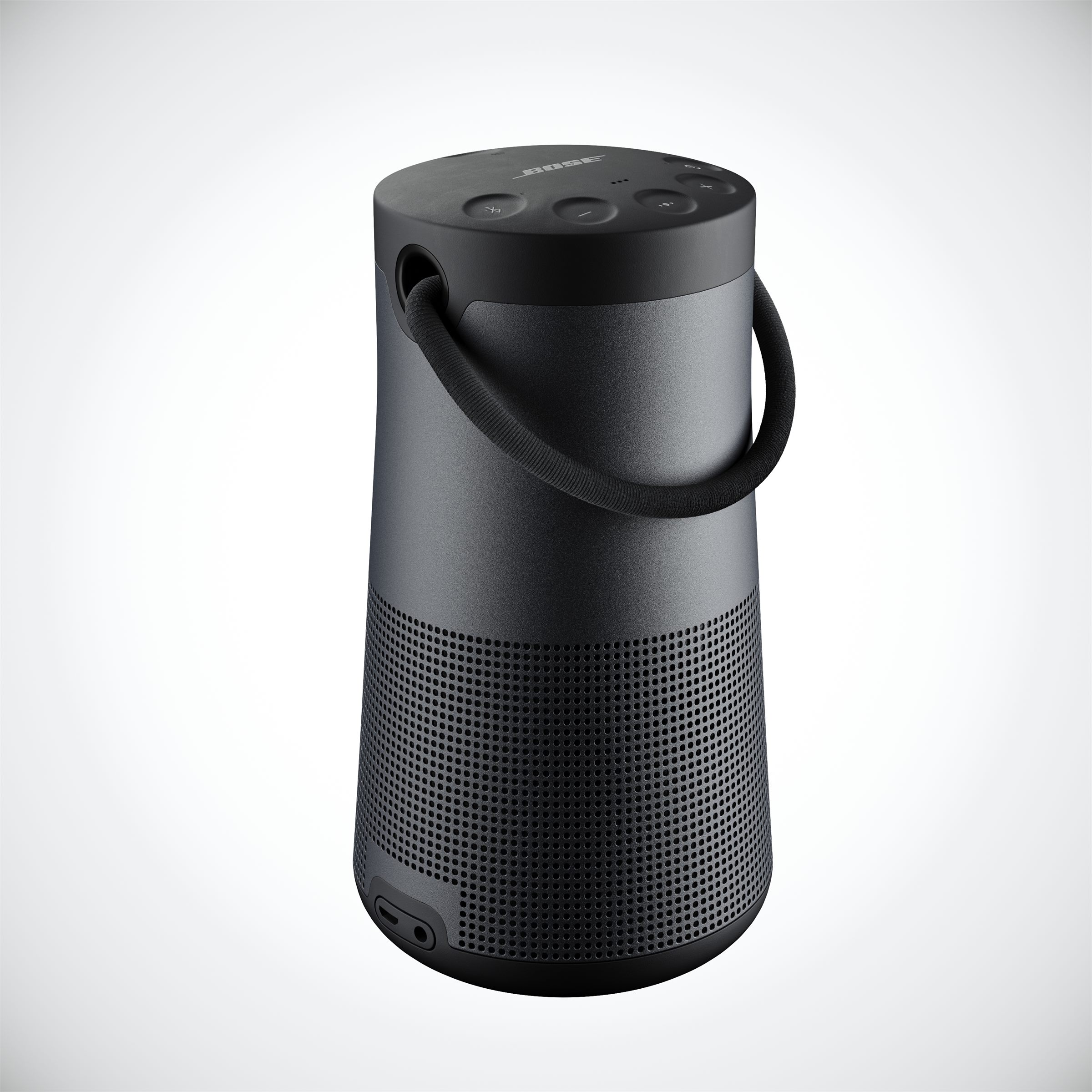 Black cylindrical portable speaker with a handle on a white background