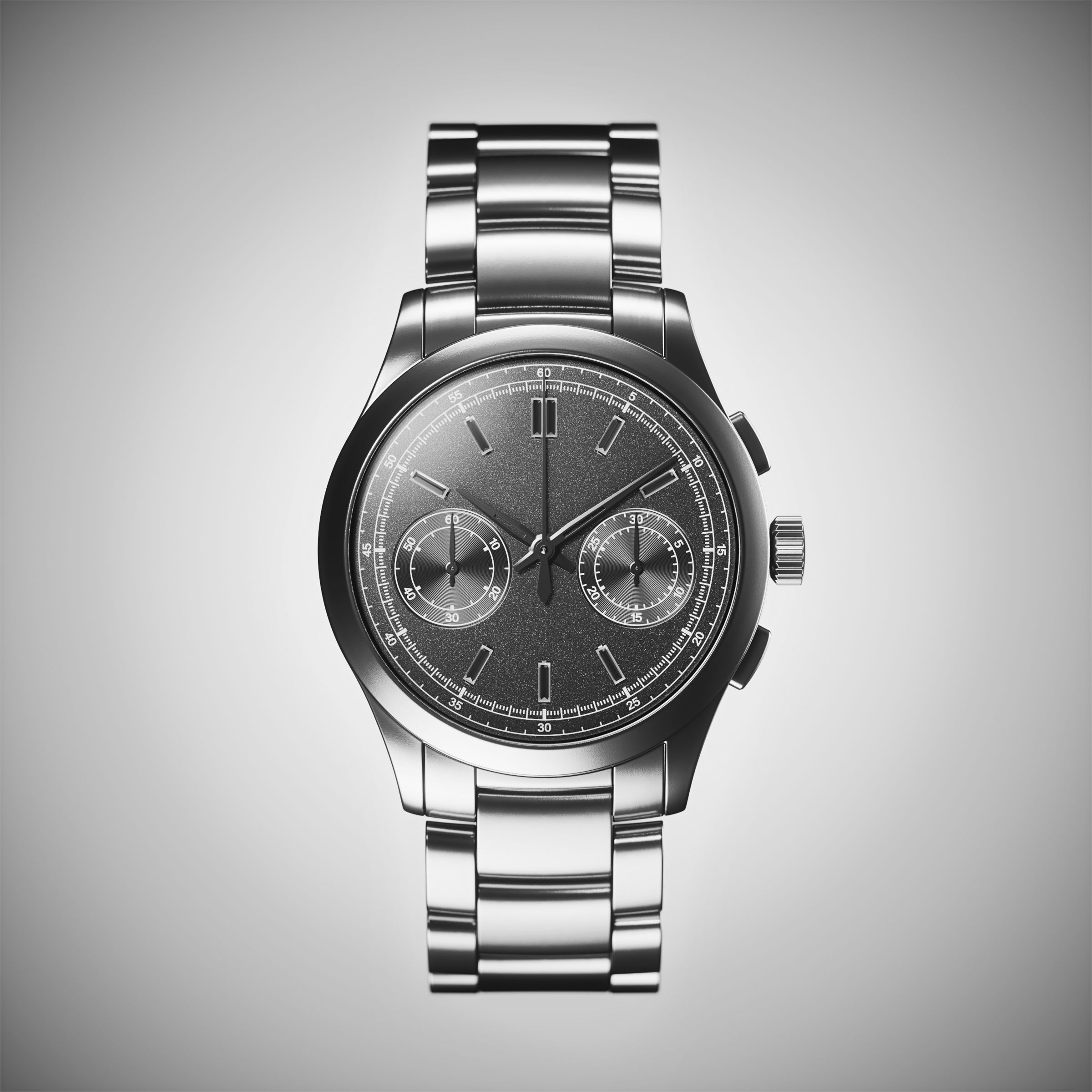 Steel chronograph wristwatch with a grey dial and link bracelet on a light background